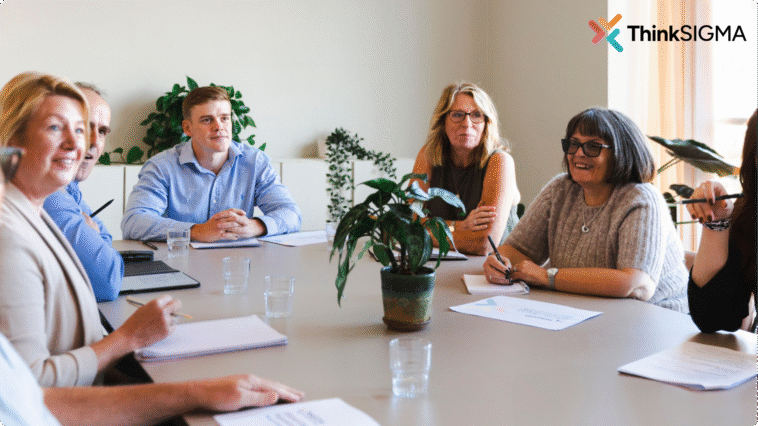 Staff training around a boardroom table