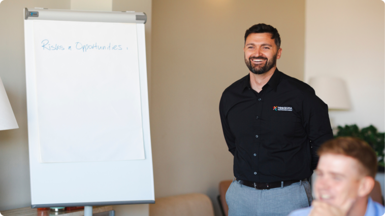 Commercial Risk Management being taught by Think Sigma's trainer Tom stoon next to a white board 