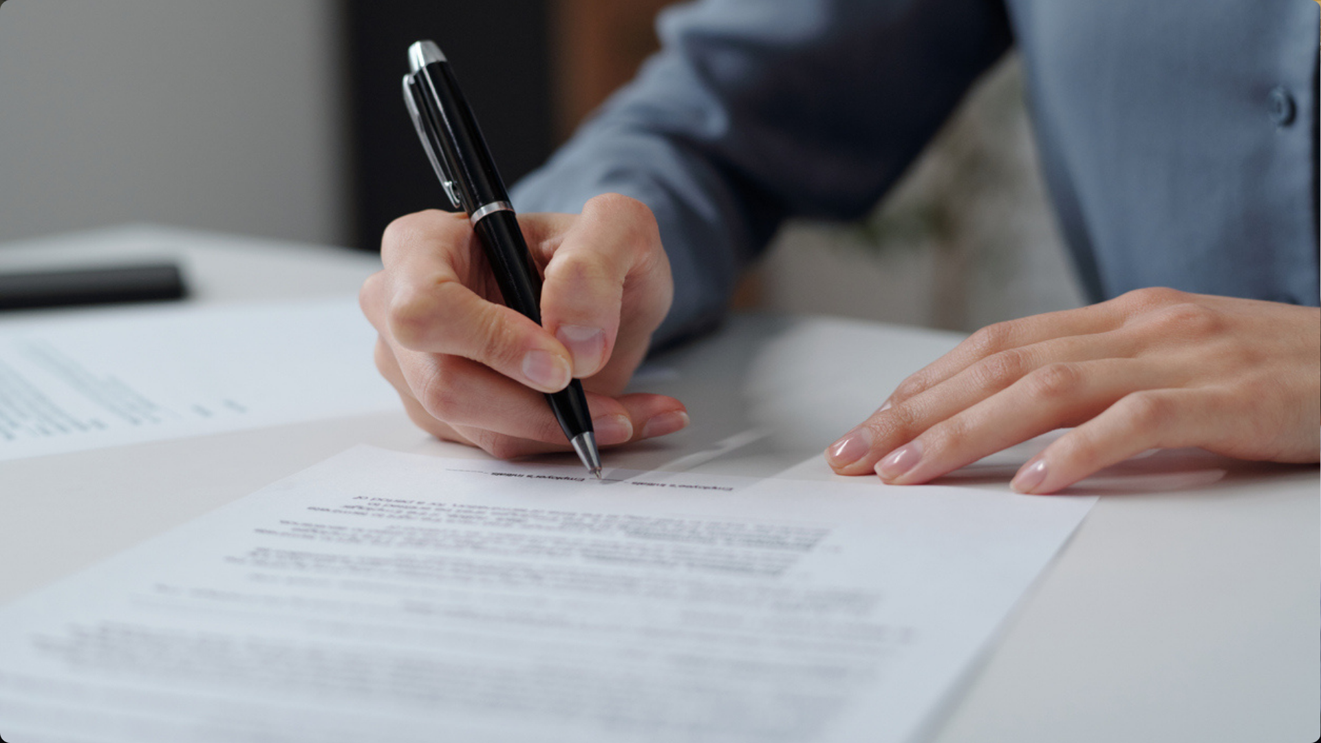 A professional looking reviewing contracts representing the Contract Management Lifecycle